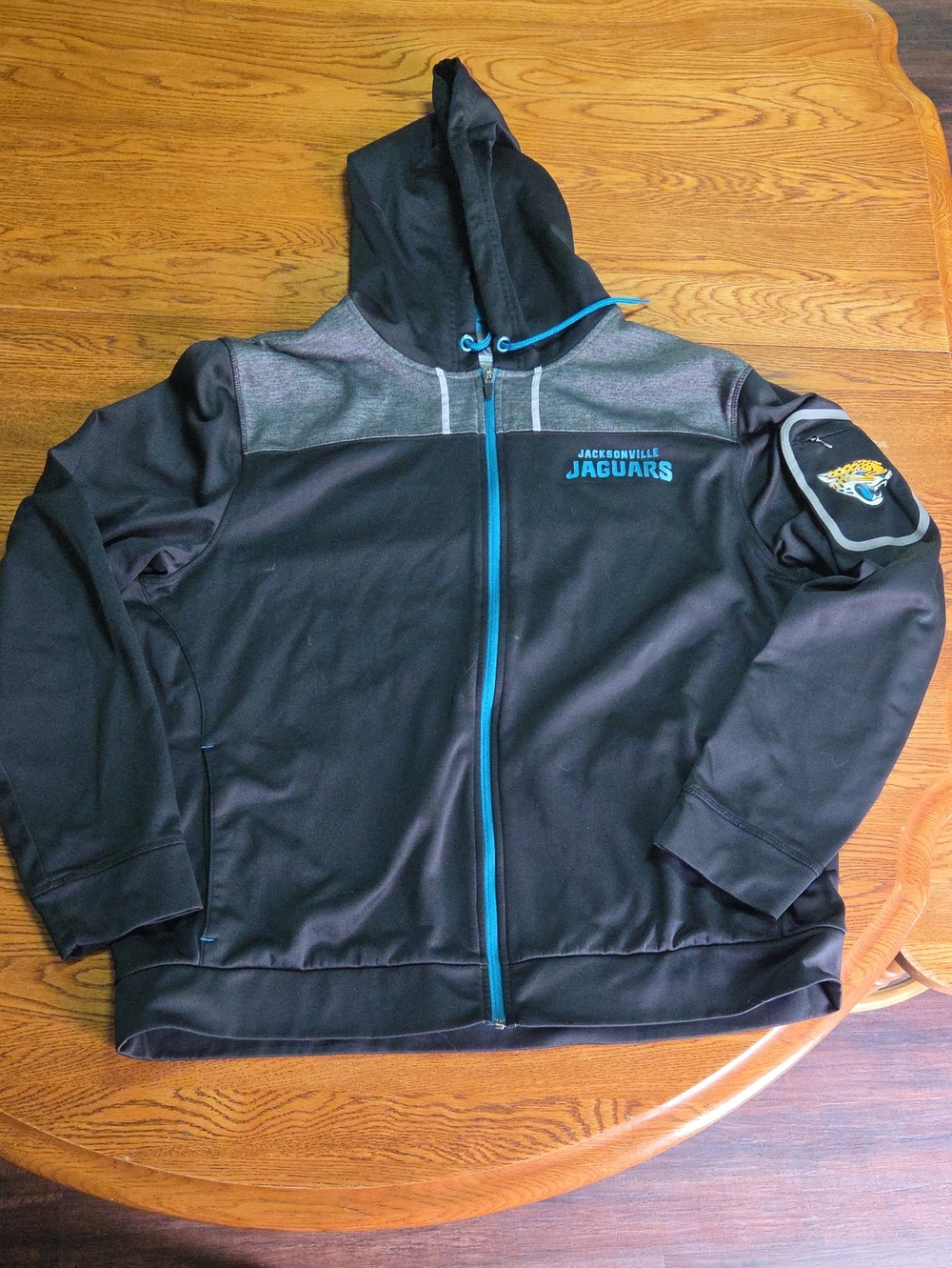 Jacksonville Jaguars Men's Black & Teal Full-Zip Windbreaker Hoodie